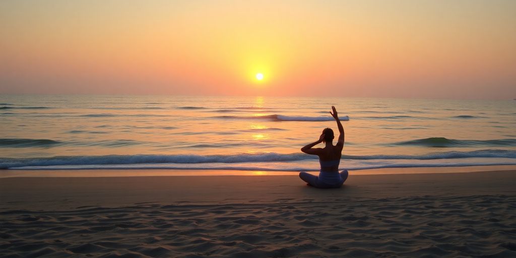 Person practicing yoga on the beach at sunset.